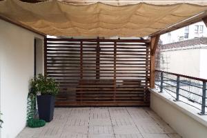 Pergola bois et solution d'ombrage en velum