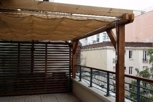 Pergola bois et solution d'ombrage en velum